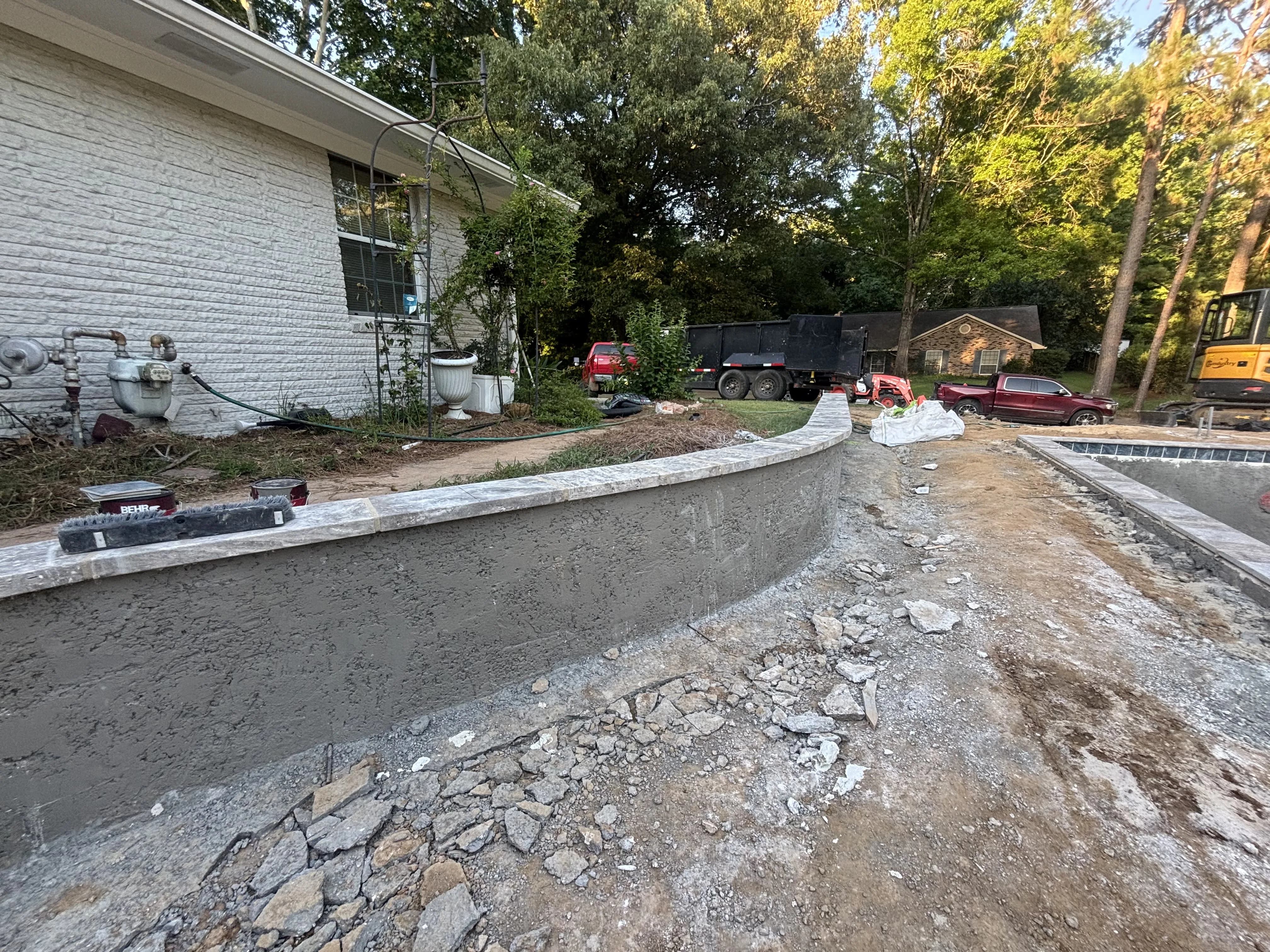 Decorative curved concrete wall near a pool, Pearl, MS